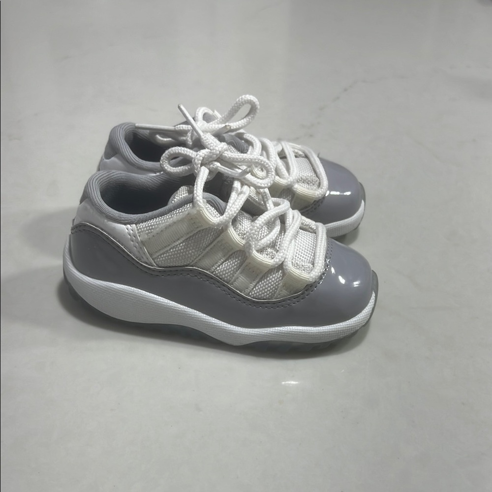 Gray and White Jordan 11 Low Sneakers